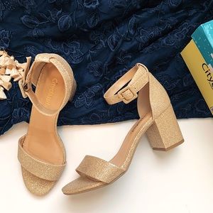 Gold shimmer open toe block heel dress sandals.